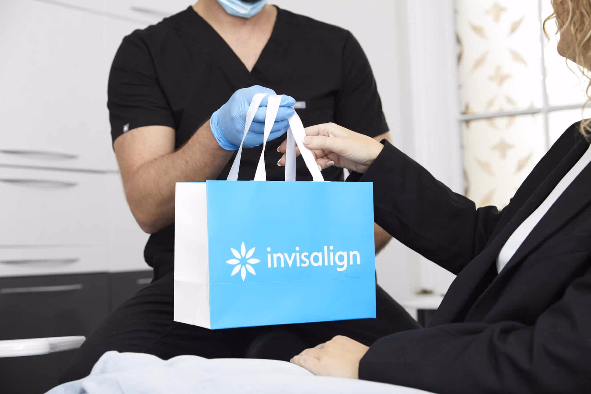 Invisalign bag being handed to patient