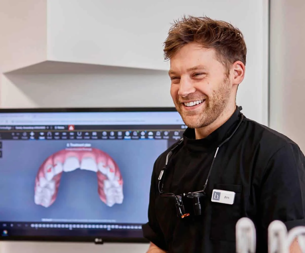 Dr Ben smiling with teeth on screen