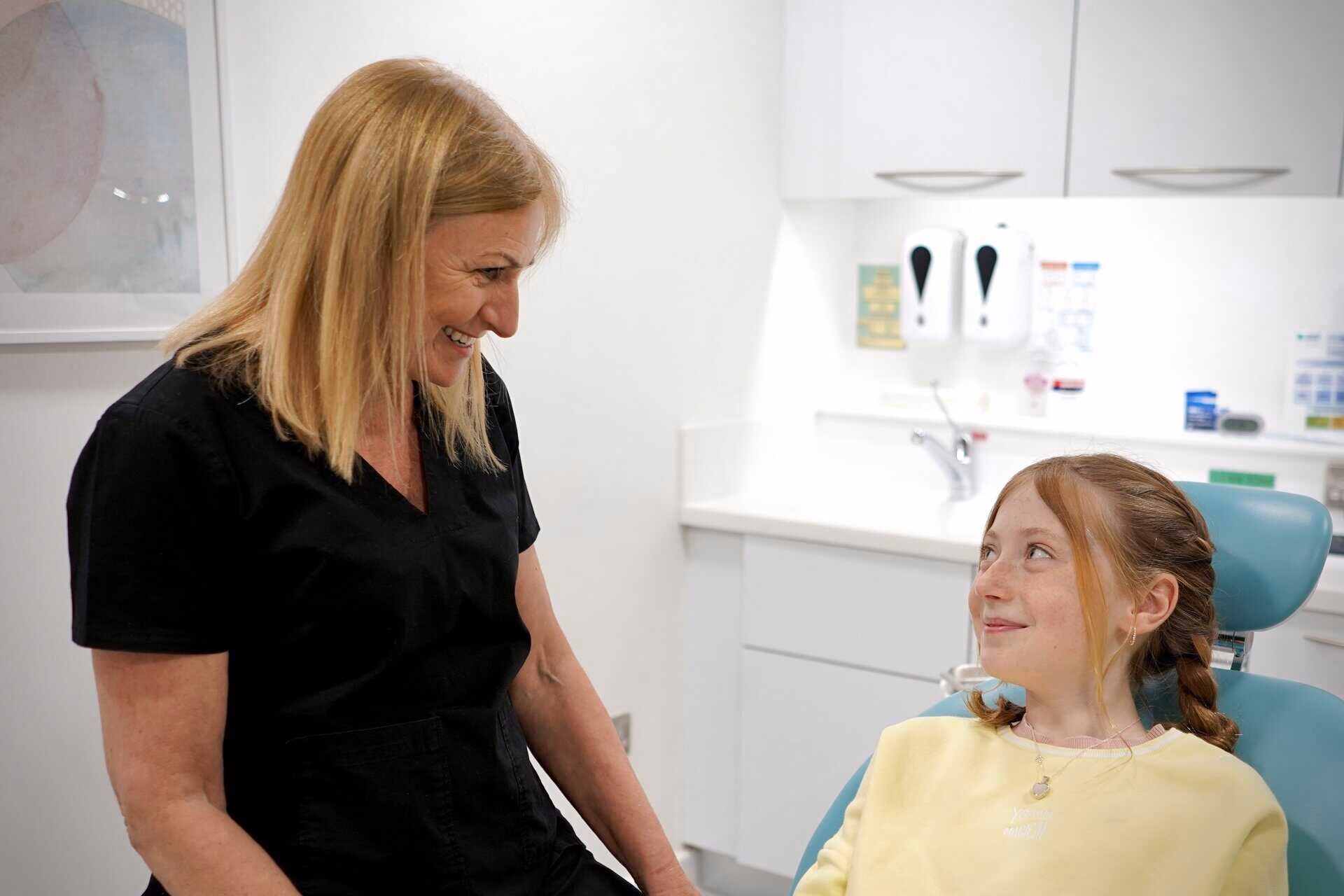 image of dentist and patient for blog on looking after your childrens oral health