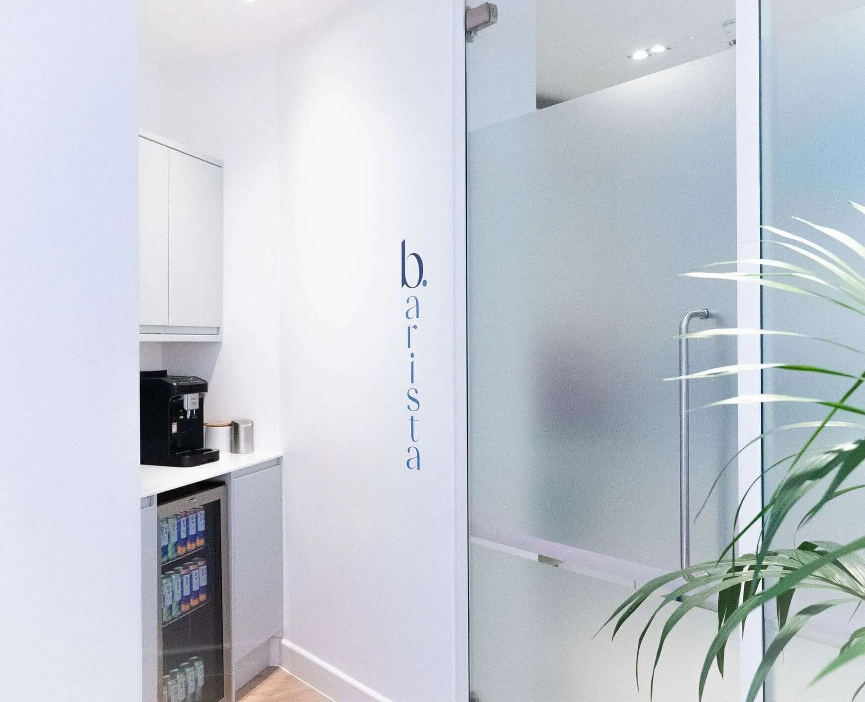 Dental clinic refreshment bar with coffee machine and drinks fridge.